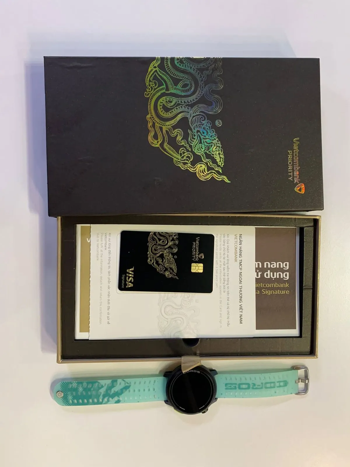 A Vietcombank Priority card box with a Visa Signature card